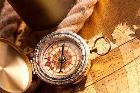 find us - Old navigation equipment, old gold colours and treasure map Stock Photo - Budget Royalty-Free & Subscription, Code: 400-05235320