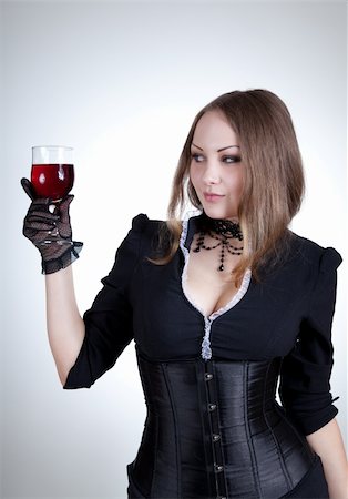 Sensual woman with glass of wine, studio shot Stock Photo - Budget Royalty-Free & Subscription, Code: 400-05235343