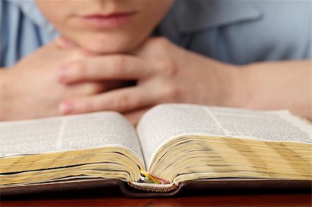 Young woman reading the Bible. Focus on the Bible Stock Photo - Budget Royalty-Free & Subscription, Code: 400-05235434