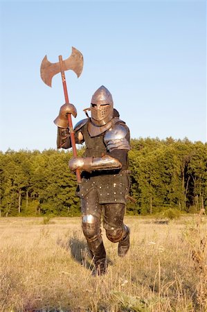 Medieval knight in the field with an axe Stock Photo - Budget Royalty-Free & Subscription, Code: 400-05236178
