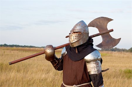 Medieval knight in the field with an axe Stock Photo - Budget Royalty-Free & Subscription, Code: 400-05236204