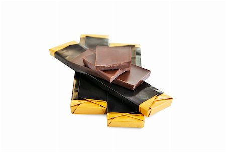 simsearch:400-05230772,k - broken chocolate bar isolated on white with clipping path Foto de stock - Royalty-Free Super Valor e Assinatura, Número: 400-05236290
