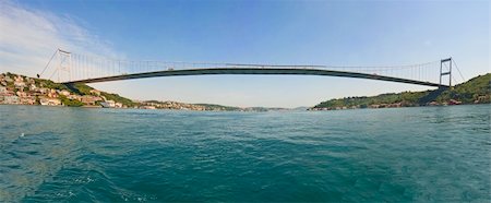 Ataturk suspension bridge spanning the Bosphorus river in Istanbul, Turkey against a blue sky Stockbilder - Microstock & Abonnement, Bildnummer: 400-05236790