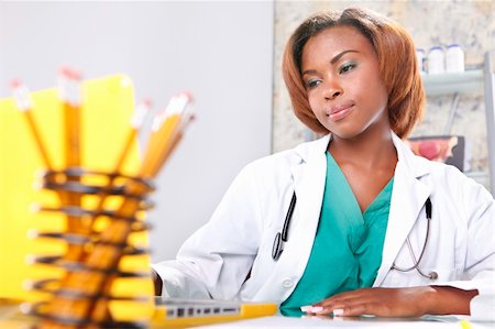 simsearch:400-04704005,k - Expressions of a doctor at her office Stock Photo - Budget Royalty-Free & Subscription, Code: 400-05237024