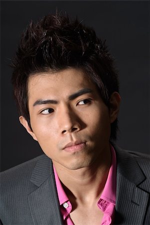 simsearch:400-04255435,k - Modern young businessman look copyspace, closeup portrait of Asian guy in dark. Foto de stock - Super Valor sin royalties y Suscripción, Código: 400-05238208