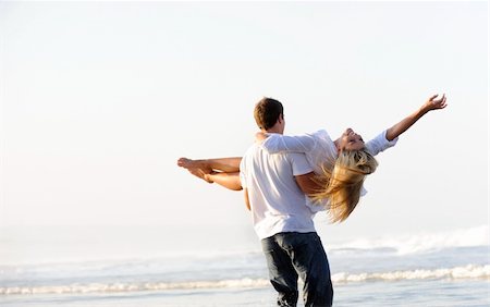 Young couple have fun in the ocean Foto de stock - Super Valor sin royalties y Suscripción, Código: 400-05238586