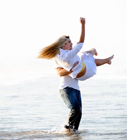 simsearch:400-04702706,k - Young couple have fun in the ocean Stockbilder - Microstock & Abonnement, Bildnummer: 400-05238587