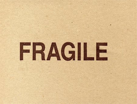 Fragile written on a corrugated cardboard packet Stock Photo - Budget Royalty-Free & Subscription, Code: 400-05239015