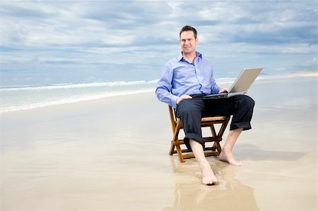 business man sitting on a chair on the beach with laptop Stock Photo - Budget Royalty-Free & Subscription, Code: 400-05239595