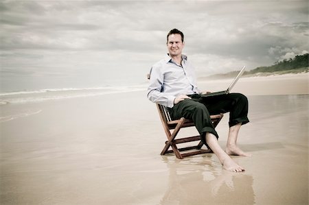 business man sitting on a chair on the beach with laptop Stock Photo - Budget Royalty-Free & Subscription, Code: 400-05239596