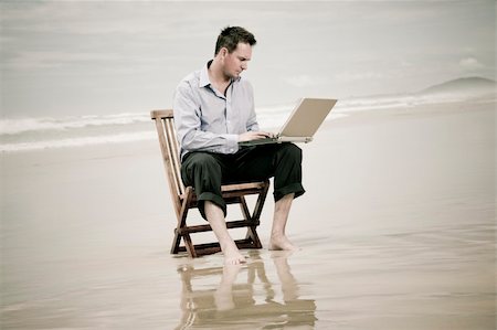 business man sitting on a chair on the beach with laptop Stock Photo - Budget Royalty-Free & Subscription, Code: 400-05239597