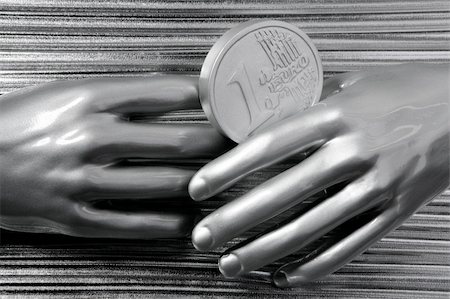 simsearch:695-05780265,k - silver euro coins in futuristic robot gray metallic hands bank metaphor Photographie de stock - Aubaine LD & Abonnement, Code: 400-05239928