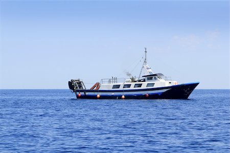 trawler fisherboat boat working in mediterranean offshore blue water Stock Photo - Budget Royalty-Free & Subscription, Code: 400-05239937