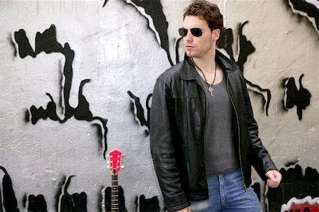 rocker rock star young man sunglasses on silver wall city outdoor Stock Photo - Budget Royalty-Free & Subscription, Code: 400-05239968