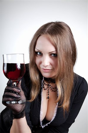 simsearch:400-04629496,k - Sensual woman with glass of wine, studio shot Photographie de stock - Aubaine LD & Abonnement, Code: 400-05230239