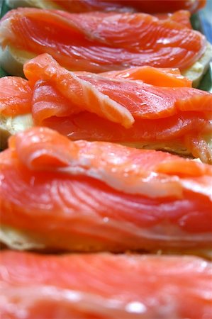 Appetizing sandwiches with salty red fish of a salmon. Abreast close up. Stock Photo - Budget Royalty-Free & Subscription, Code: 400-05230923