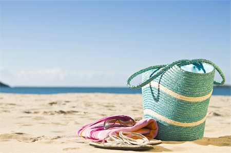 summer beach sea backgrounds - Beautiful summer day at the beach. Focus on beach towel, bag and accessories. Stock Photo - Budget Royalty-Free & Subscription, Code: 400-05231160