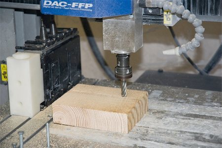 fräsen - CNC machine milling wood part Stockbilder - Microstock & Abonnement, Bildnummer: 400-05231430