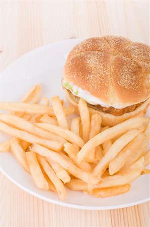 fishburger - burger and chips food on a table Stock Photo - Budget Royalty-Free & Subscription, Code: 400-05232225