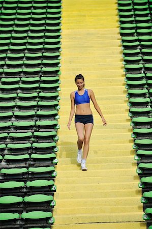 simsearch:400-07918985,k - woman jogging at athletics stadium Stock Photo - Budget Royalty-Free & Subscription, Code: 400-05232910