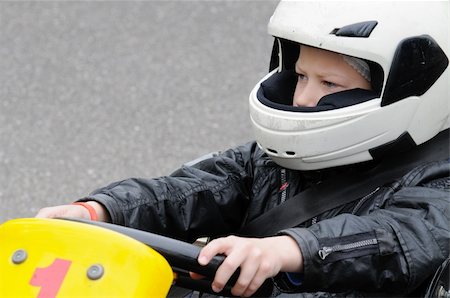 Boy is going for his first karting race. Stock Photo - Budget Royalty-Free & Subscription, Code: 400-05233183