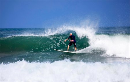 simsearch:400-07217949,k - Adult men - the surfer in ocean. Bali. Indonesia Foto de stock - Super Valor sin royalties y Suscripción, Código: 400-05244328