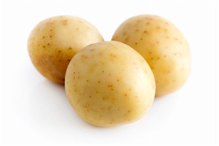 staple crop - Three potatoes isolated on a white background. Stock Photo - Budget Royalty-Free & Subscription, Code: 400-05244704