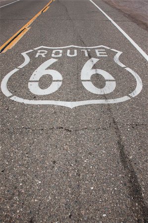 photosurfer (artist) - A sign reading "Route 66" is stenciled on the highway on a stretch of road that was once Route 66. Stock Photo - Budget Royalty-Free & Subscription, Code: 400-05245569