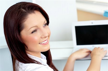 simsearch:400-04341796,k - Charming businesswoman using her laptop in the office Stockbilder - Microstock & Abonnement, Bildnummer: 400-05246145