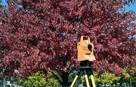 simsearch:400-04710606,k - Surveying during colorful fall - orange theodolite. Stock Photo - Budget Royalty-Free & Subscription, Code: 400-05246553