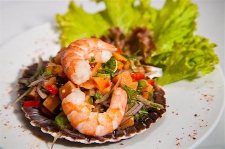 Peruvian ceviche. Made wiht shirmp, fish, onion, aji, rocoto, fresh tomatoes, parsley. Fotografie stock - Microstock e Abbonamento, Codice: 400-05246878