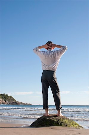 simsearch:400-04790531,k - Businessman standing barefoot on a rock at the sea Foto de stock - Royalty-Free Super Valor e Assinatura, Número: 400-05247184