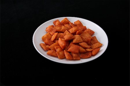 simsearch:400-06700713,k - Orange   spice    snack    on   black   background Photographie de stock - Aubaine LD & Abonnement, Code: 400-05247190