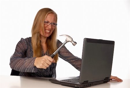 Furious secretary attempting to trash her hated laptop Stock Photo - Budget Royalty-Free & Subscription, Code: 400-05247283