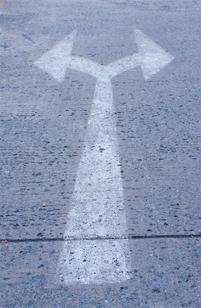 directing traffic - arrow to cross on the street,sign to the street Stock Photo - Budget Royalty-Free & Subscription, Code: 400-05247515