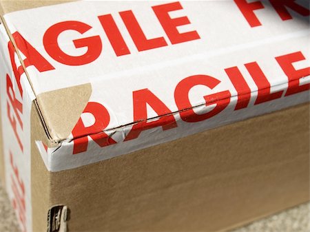 Detail of a fragile corrugated cardboard packet Stock Photo - Budget Royalty-Free & Subscription, Code: 400-05248092