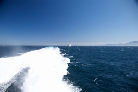 jet and wake of a boat at straits of gibraltar in andalusia spain Fotografie stock - Microstock e Abbonamento, Codice: 400-05248116