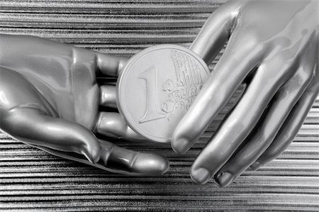 simsearch:695-05780265,k - silver euro coins in futuristic robot gray metallic hands bank metaphor Photographie de stock - Aubaine LD & Abonnement, Code: 400-05248163