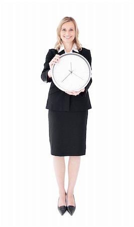 Glowing businesswoman holding a clock against white background Stock Photo - Budget Royalty-Free & Subscription, Code: 400-05248510