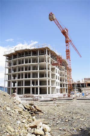 wide view of engineering architectural development outdoors unfinished exterior building in construction , machinery and material Fotografie stock - Microstock e Abbonamento, Codice: 400-05248648