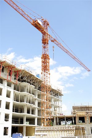 wide view of engineering architectural development outdoors unfinished exterior building in construction , machinery and material Fotografie stock - Microstock e Abbonamento, Codice: 400-05248650