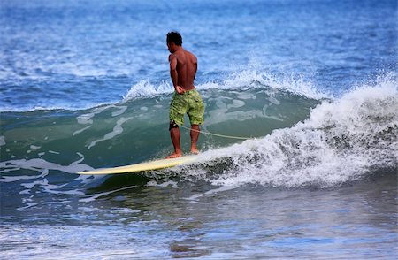 simsearch:400-04108589,k - Young men - the surfer in ocean. Bali. Indonesia Foto de stock - Super Valor sin royalties y Suscripción, Código: 400-05249452