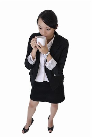 simsearch:400-04255435,k - Business woman with cup of coffee with lonely expression, full length portrait isolated on white background. Foto de stock - Super Valor sin royalties y Suscripción, Código: 400-05249623