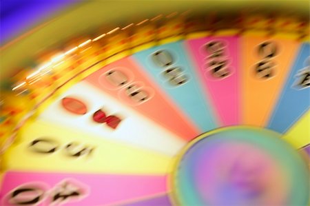 simsearch:700-00616801,k - Blurry colorful glow gambling roulette motion blur  lights Fotografie stock - Microstock e Abbonamento, Codice: 400-05240026