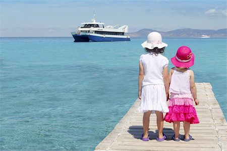 family in boat by beach - little sisters tourist turquoise sea back in Formentera Stock Photo - Budget Royalty-Free & Subscription, Code: 400-05240035