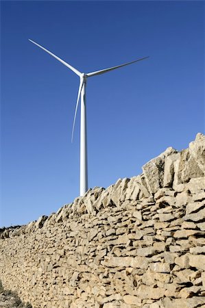 simsearch:400-07111713,k - Electric windmills with a masonry rural wall on the front Stockbilder - Microstock & Abonnement, Bildnummer: 400-05240181
