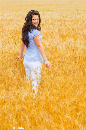 Young girl on wheat field Stock Photo - Budget Royalty-Free & Subscription, Code: 400-05240196