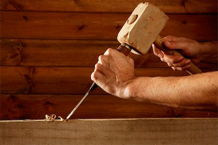 picture of old man construction worker - gouge wood chisel carpenter tool hammer in hand working wooden background Stock Photo - Budget Royalty-Free & Subscription, Code: 400-05240206