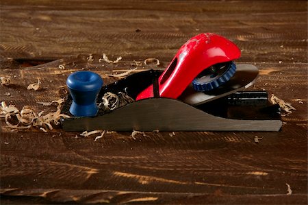 planer carpenter hand tool wood shaving over wooden board Stock Photo - Budget Royalty-Free & Subscription, Code: 400-05240207