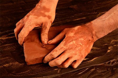 artist man hands working red clay to create handcraft art Stock Photo - Budget Royalty-Free & Subscription, Code: 400-05240211